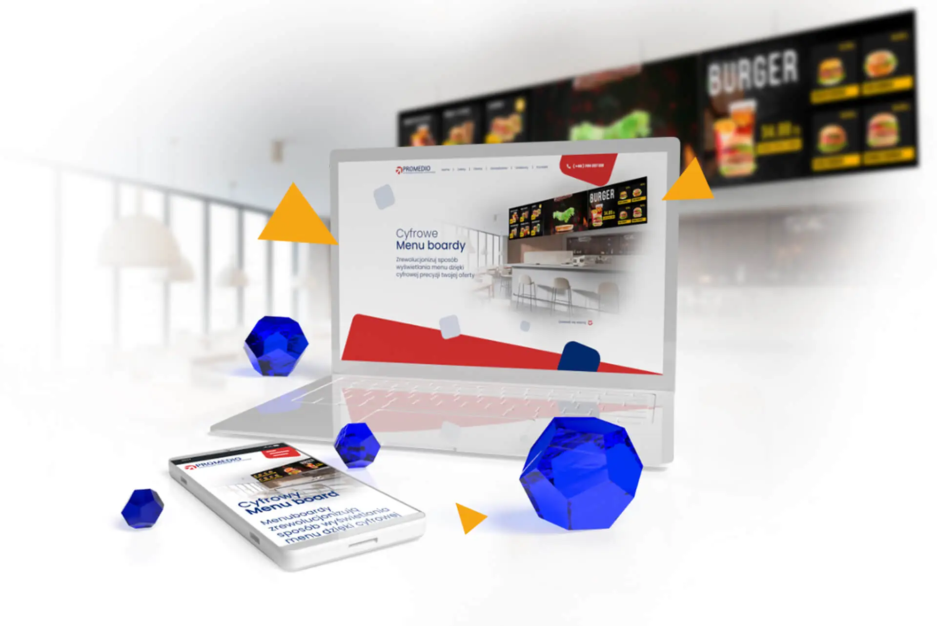 Wizualizacja projektu strony www na laptopie i smartfonie, przedstawiająca cyfrowe menu boardy w restauracji, symbolizująca nowoczesne rozwiązania technologiczne w branży gastronomicznej.